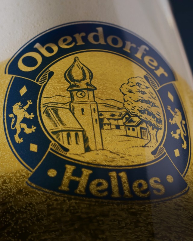 Ein goldfarbenes Logo zeigt eine Kirche und Bäume innerhalb einer Silhouette.